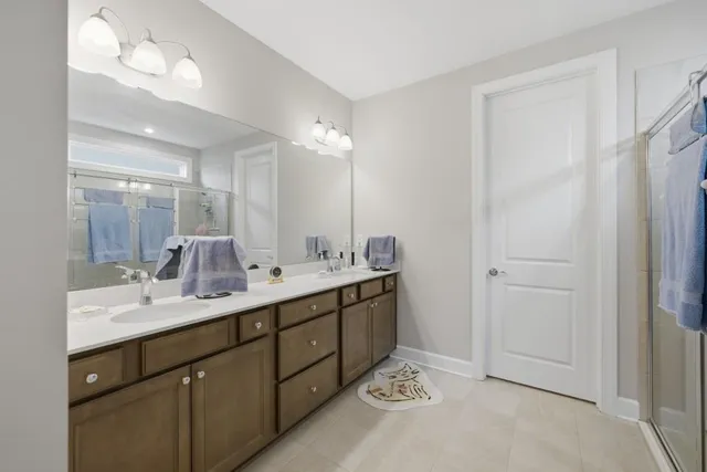 a living room with furniture and floor to ceiling windows