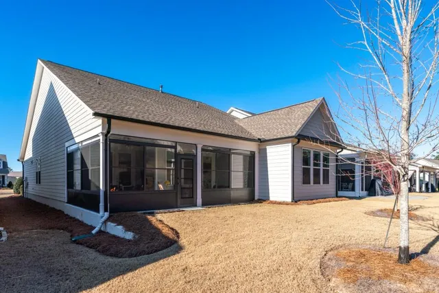 a view of a living room and dining room