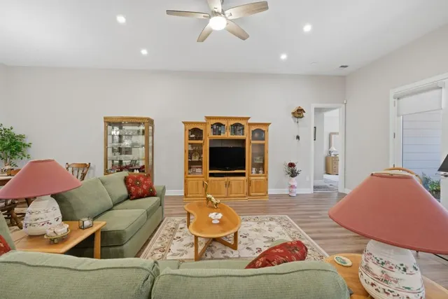 a front view of a house with garden and plants