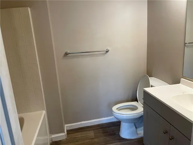 a bathroom with a toilet and a sink