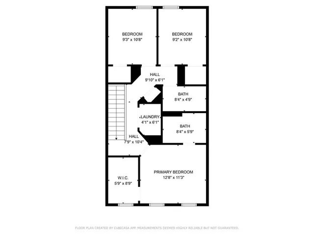 a picture of a bench in front of a wall