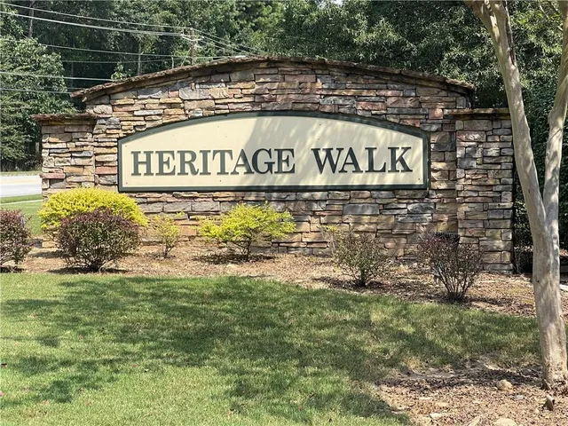 a sign of golf club on a brick wall