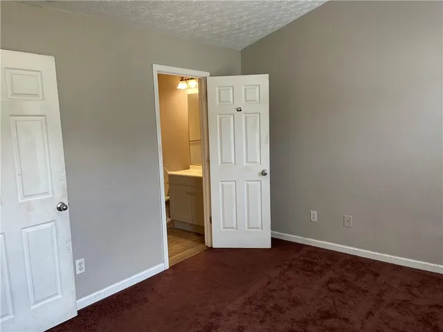 an empty room with closet area