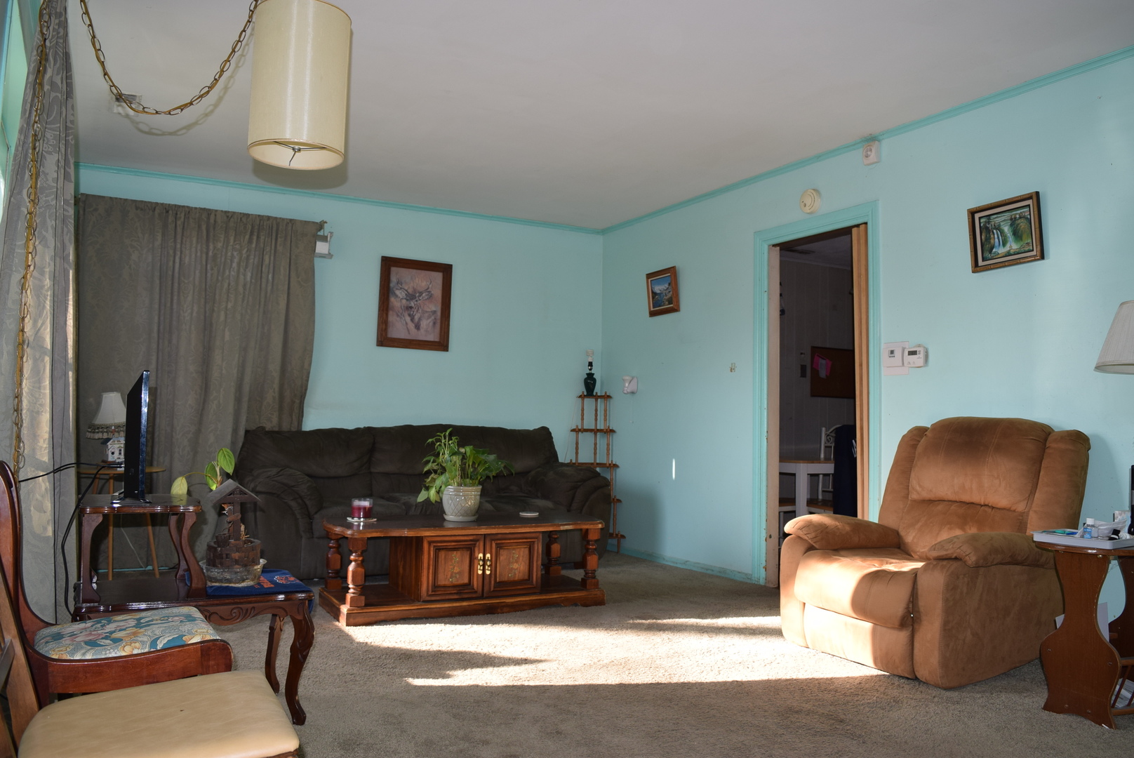 2112 Hawthorne Road Homewood, IL 60430 - Photo 4 of 13 a living room with furniture a couch and a flat screen tv