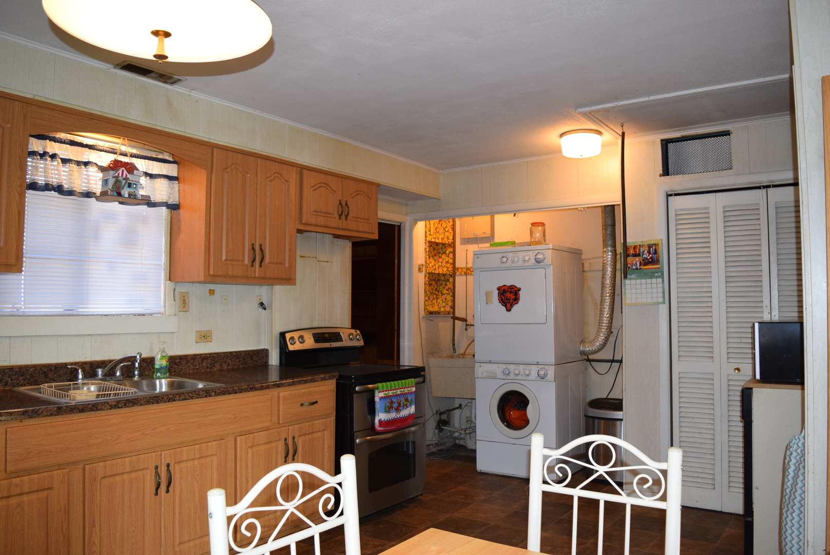 2112 Hawthorne Road Homewood, IL 60430 - Photo 9 of 13 a kitchen with stainless steel appliances granite countertop a stove a sink and a refrigerator