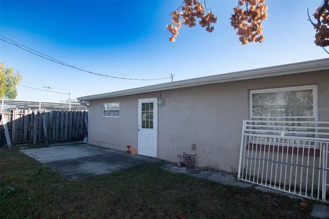 a kitchen with stainless steel appliances white cabinets and a stove a refrigerator with wooden floor