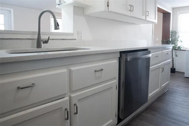 a view of a storage room with furniture fridge and stairs