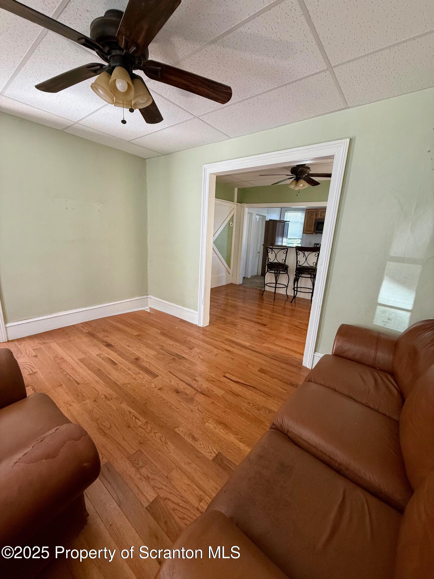 97 Washington Street Carbondale, PA 18407 - Photo 5 of 18 a view of livingroom with furniture and window