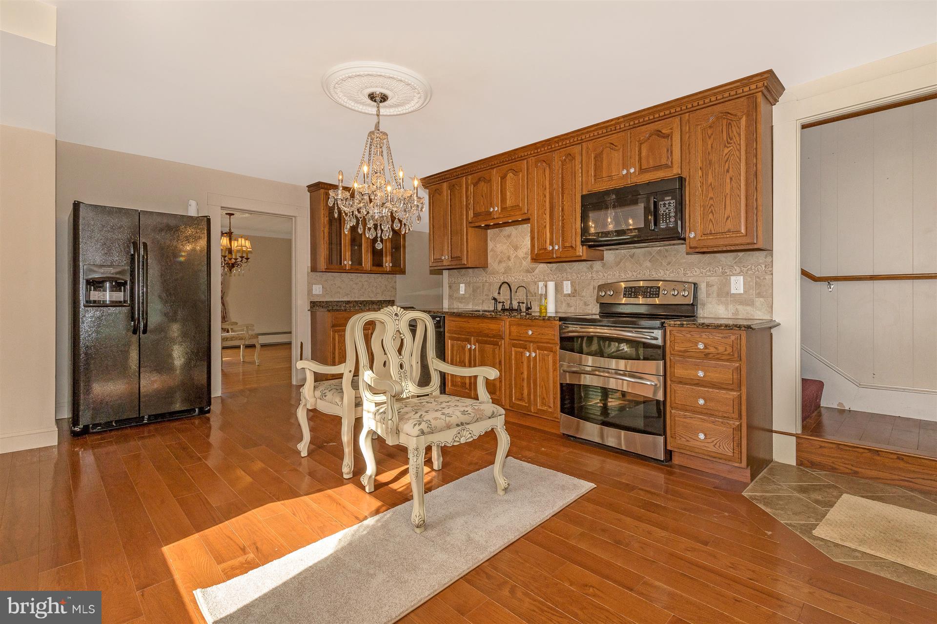 332 South Clear Ridge Road New Windsor, MD 21776 - Photo 8 of 47 a bedroom with furniture and a wooden floor