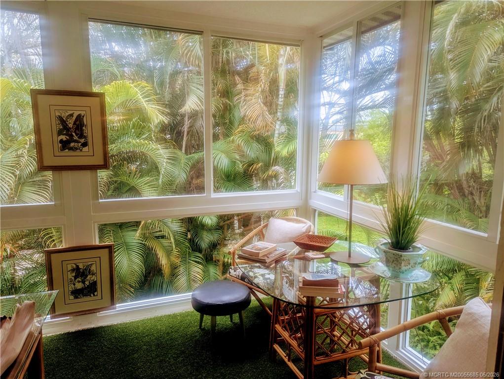 2950 Southeast Ocean Boulevard, Unit 56 Stuart, FL 34996 - Photo 6 of 12 a room with furniture and a floor to ceiling window
