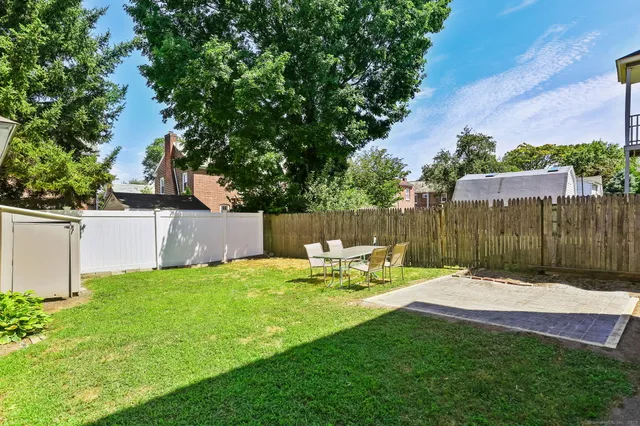 a view of a chair and table in the yard