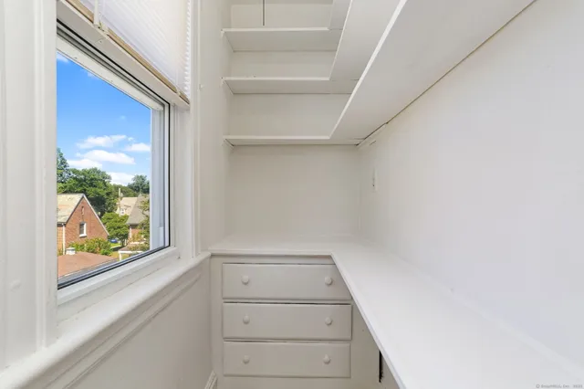 a view of a small space with racks on the wall