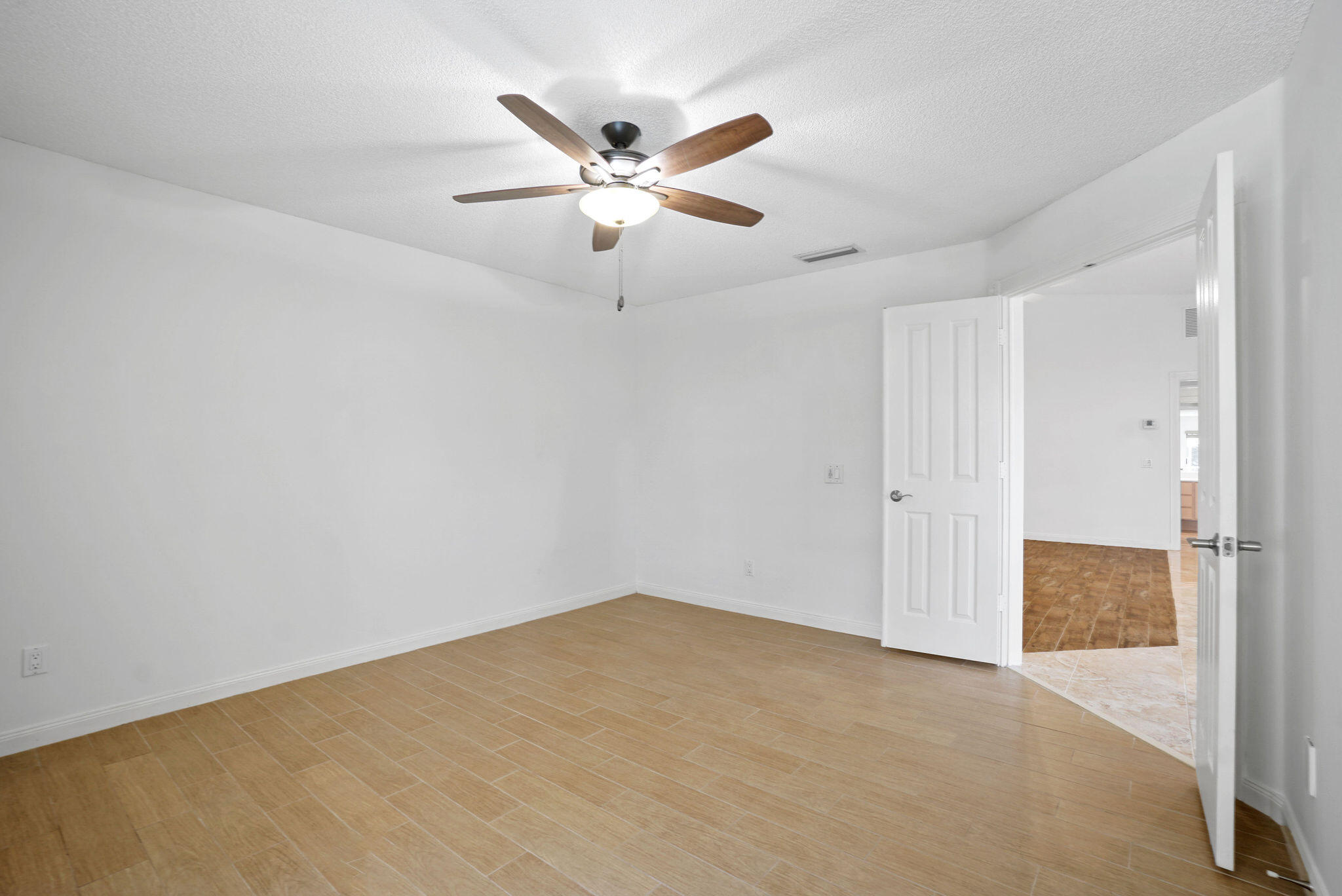 198 Brier Circle Jupiter, FL 33458 - Photo 23 of 38 an empty room with closet and fan