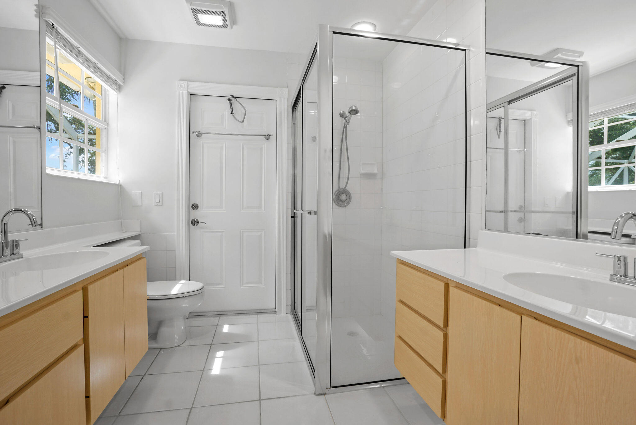 198 Brier Circle Jupiter, FL 33458 - Photo 25 of 38 a bathroom with a granite countertop sink a toilet and shower