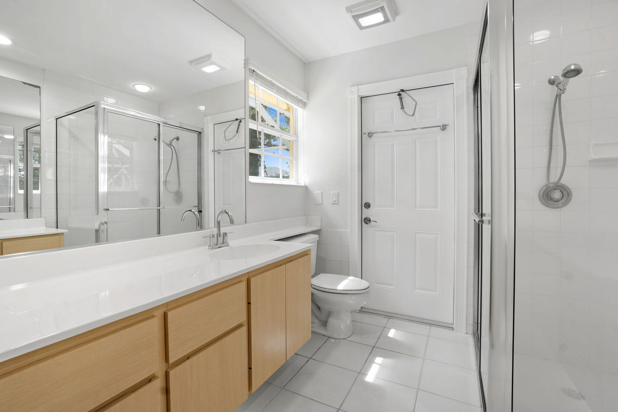 198 Brier Circle Jupiter, FL 33458 - Photo 26 of 38 a bathroom with a sink a toilet and shower