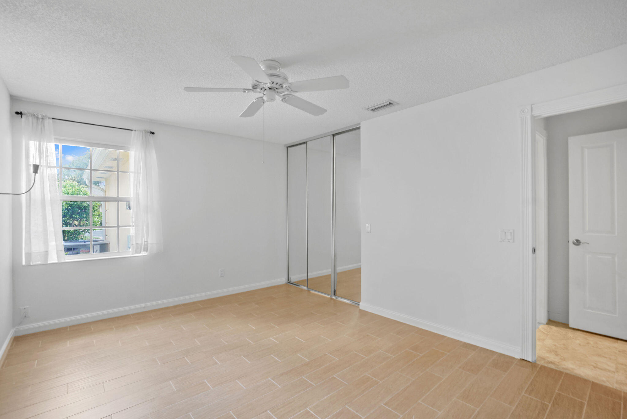 198 Brier Circle Jupiter, FL 33458 - Photo 29 of 38 a view of an empty room with a window