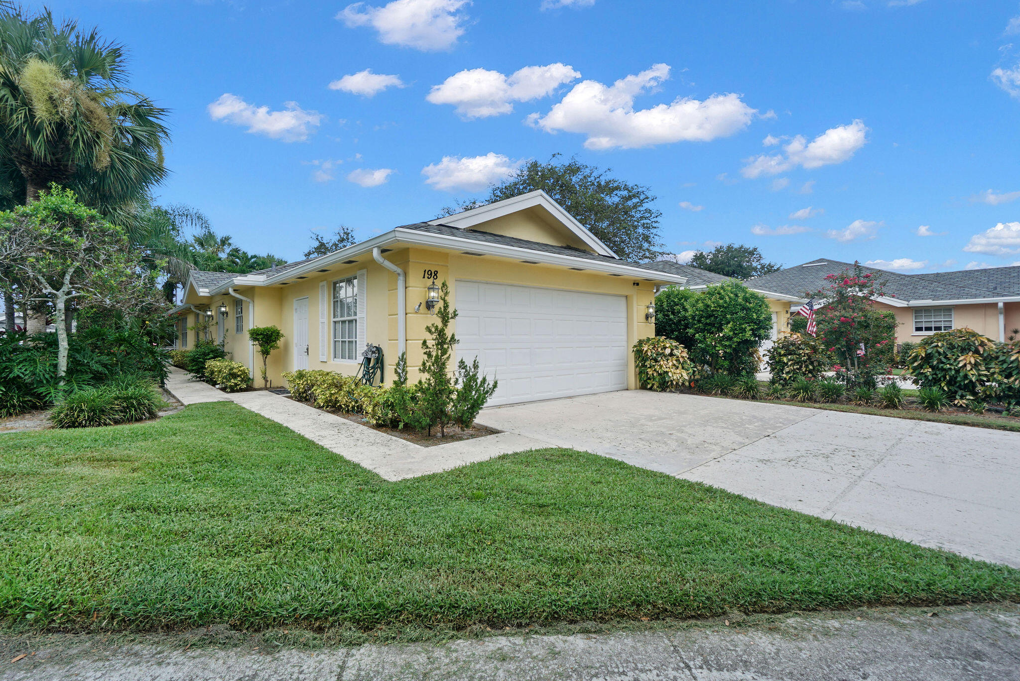 198 Brier Circle Jupiter, FL 33458 - Photo 3 of 38 a front view of house with yard and green space