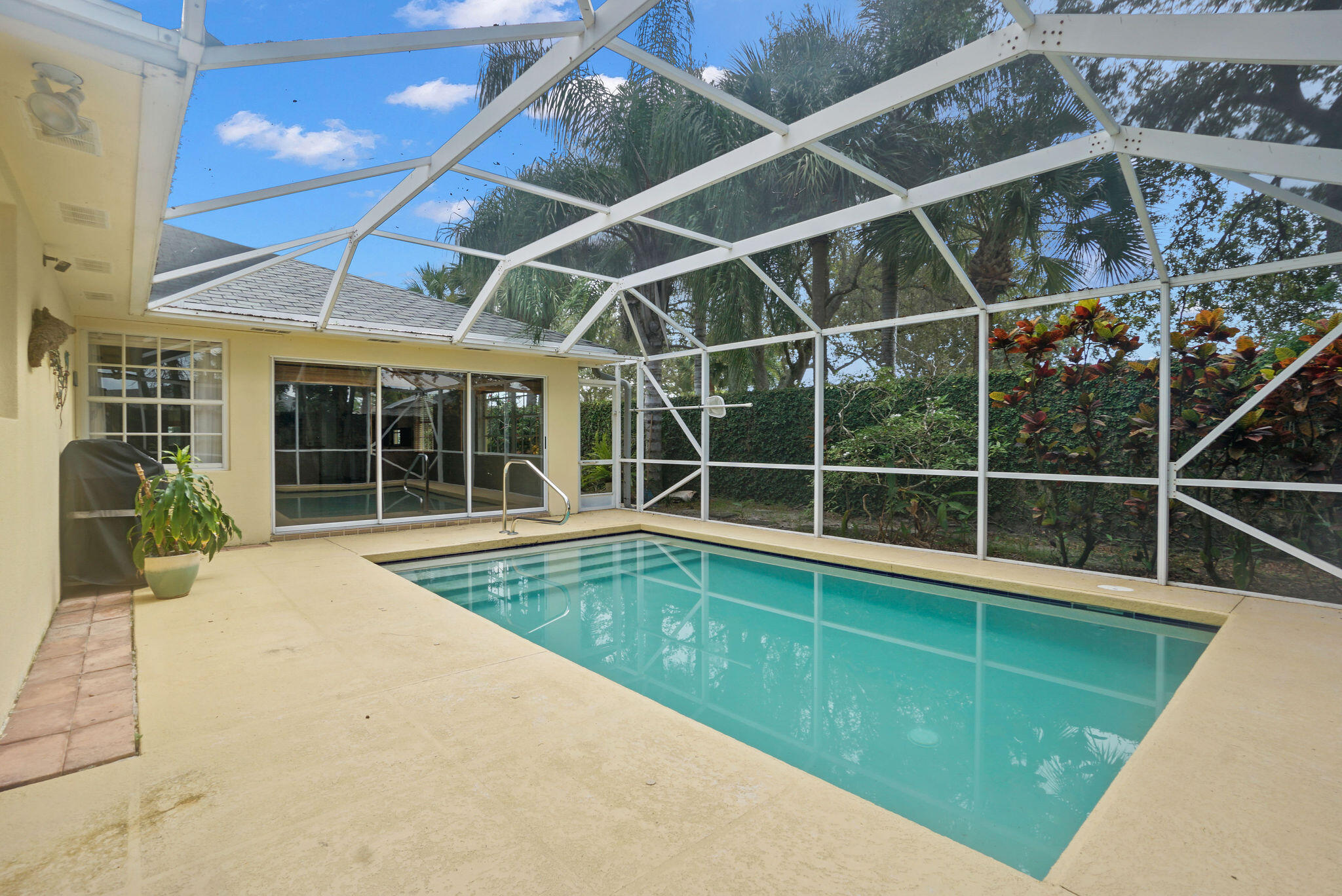198 Brier Circle Jupiter, FL 33458 - Photo 35 of 38 a view of a backyard with a swimming pool