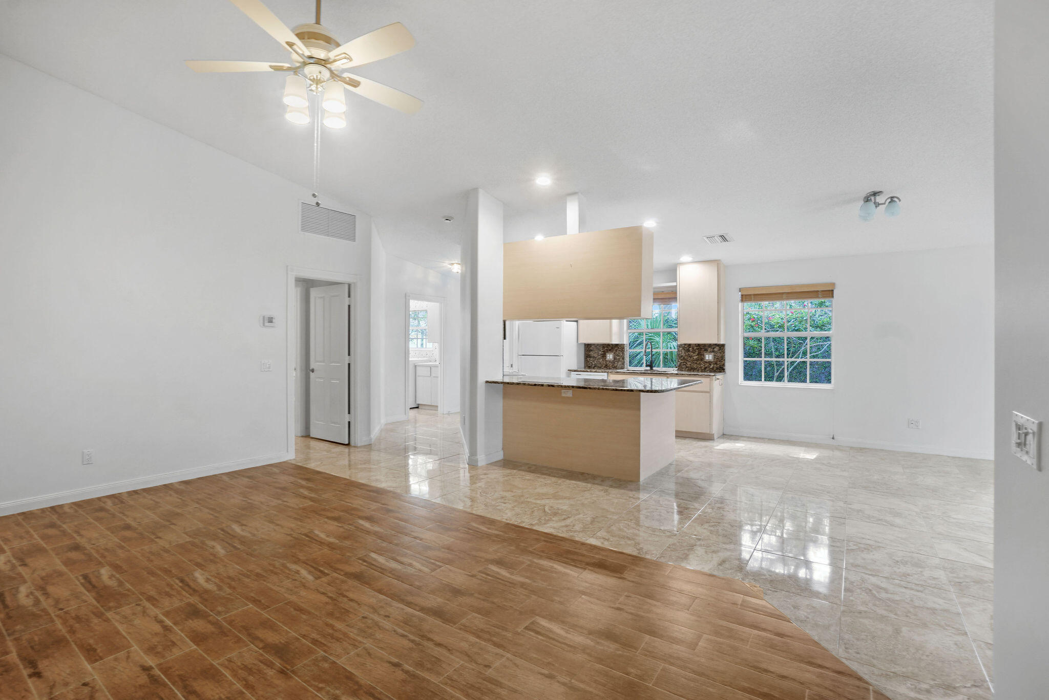 198 Brier Circle Jupiter, FL 33458 - Photo 9 of 38 a view of a kitchen with kitchen and wooden floor