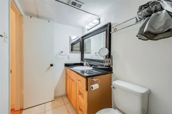 a stove top oven sitting inside of a kitchen
