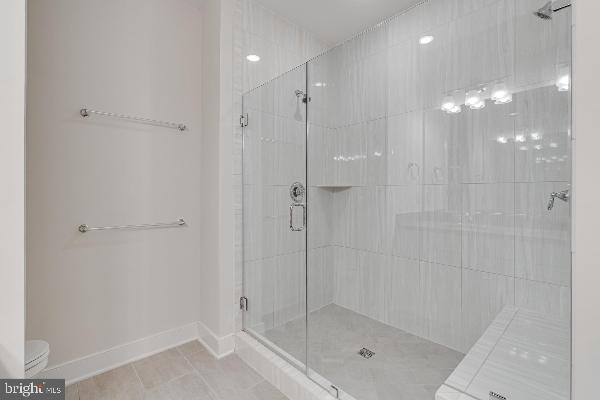 11200 Reston Station Boulevard, Unit 207 Reston, VA 20190 - Photo 18 of 40 a bathroom with a shower