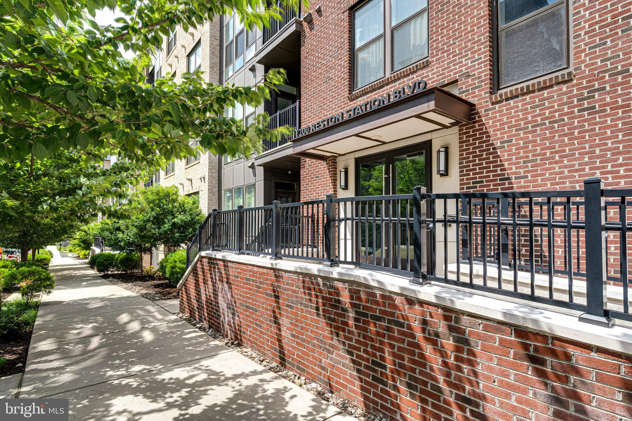 11200 Reston Station Boulevard, Unit 207 Reston, VA 20190 - Photo 2 of 40 a view of a house with a deck