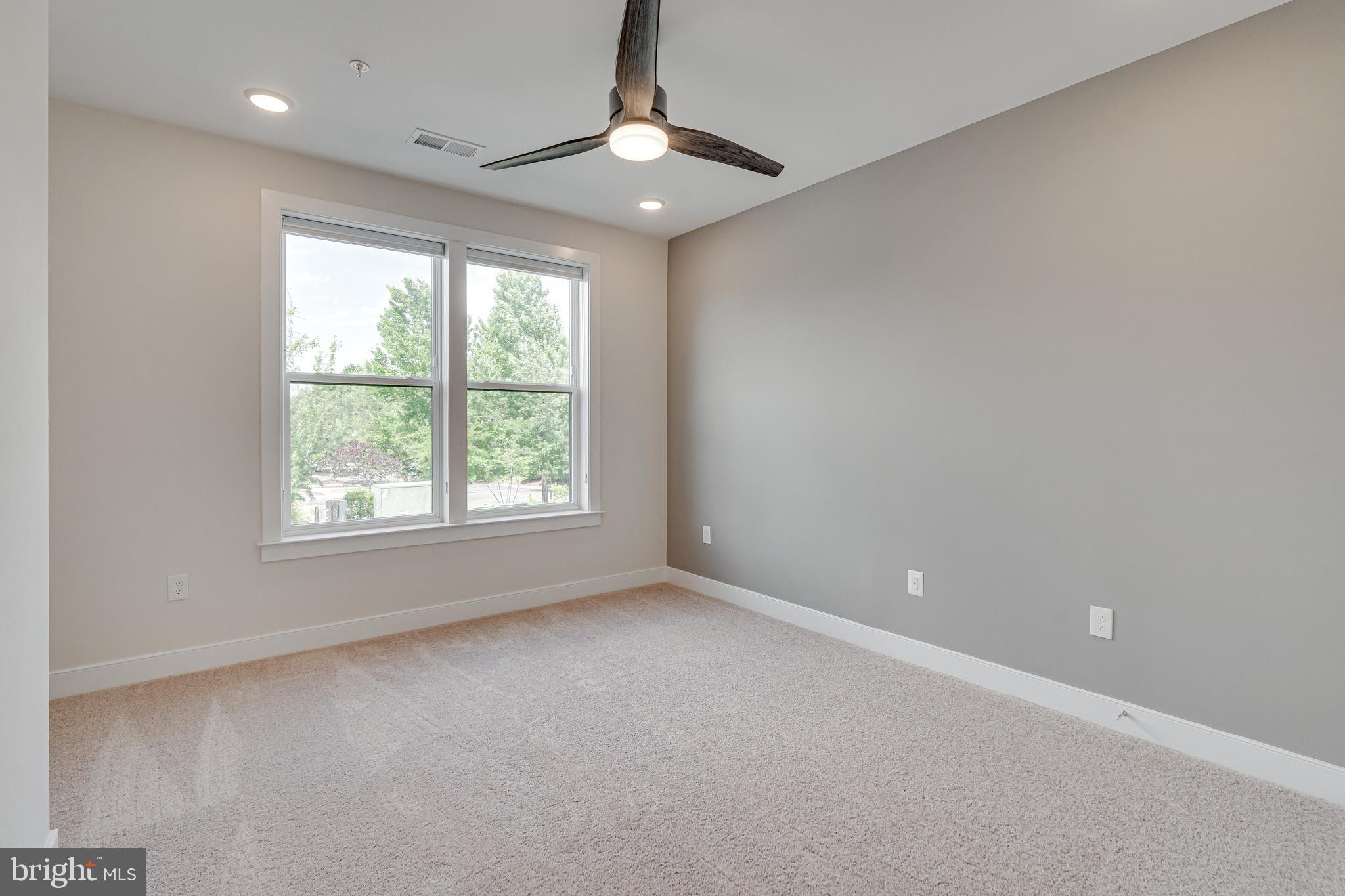 11200 Reston Station Boulevard, Unit 207 Reston, VA 20190 - Photo 19 of 40 a view of an empty room with a window