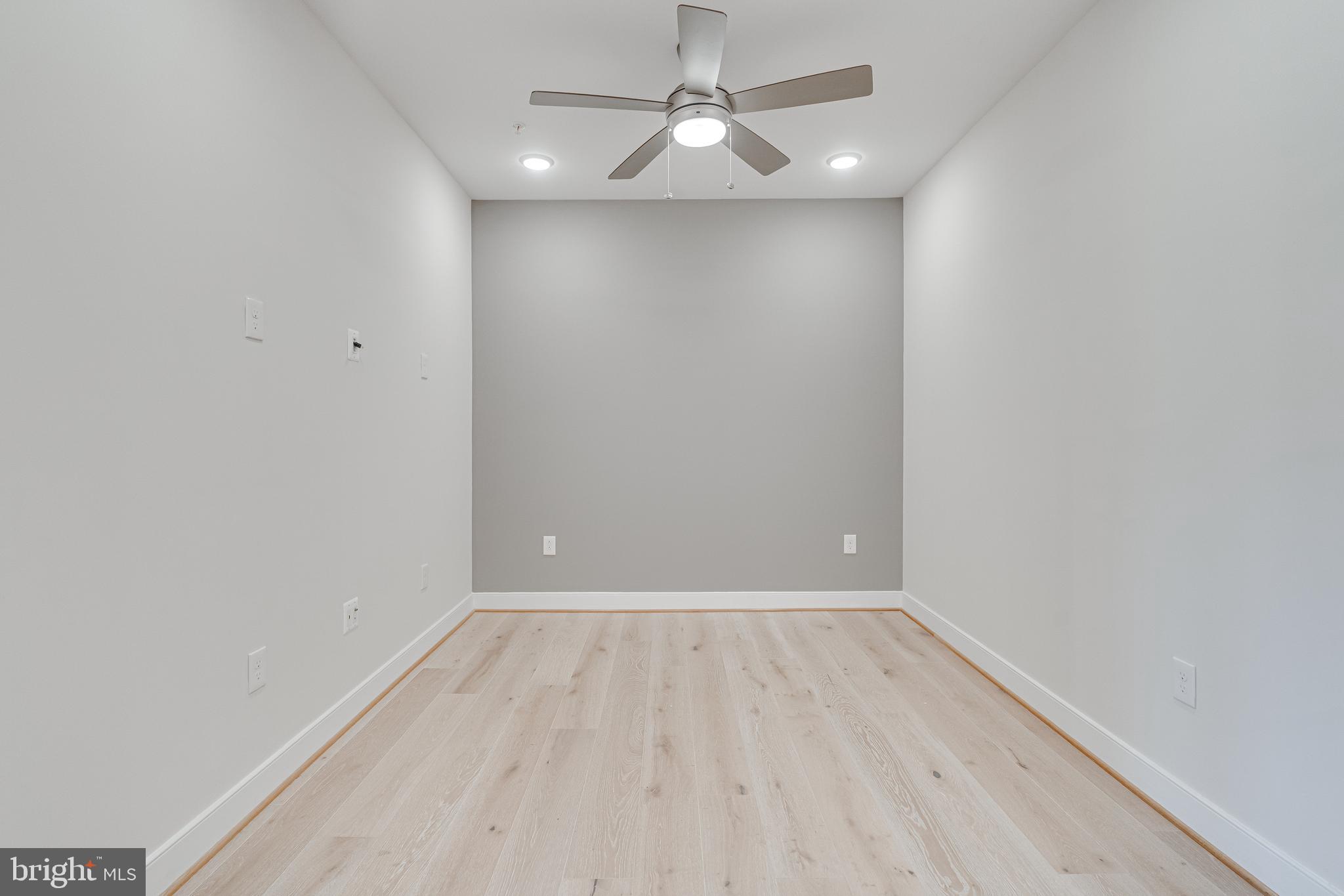 11200 Reston Station Boulevard, Unit 207 Reston, VA 20190 - Photo 24 of 40 a view of an empty room with wooden floor