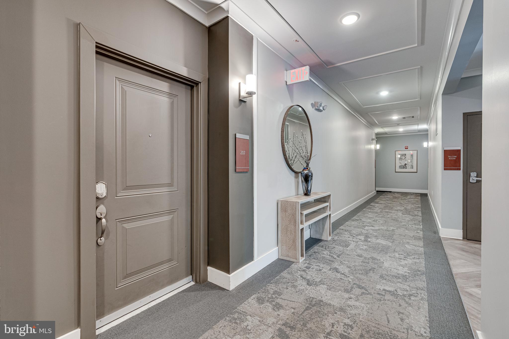 11200 Reston Station Boulevard, Unit 207 Reston, VA 20190 - Photo 30 of 40 a view of a hallway with entryway