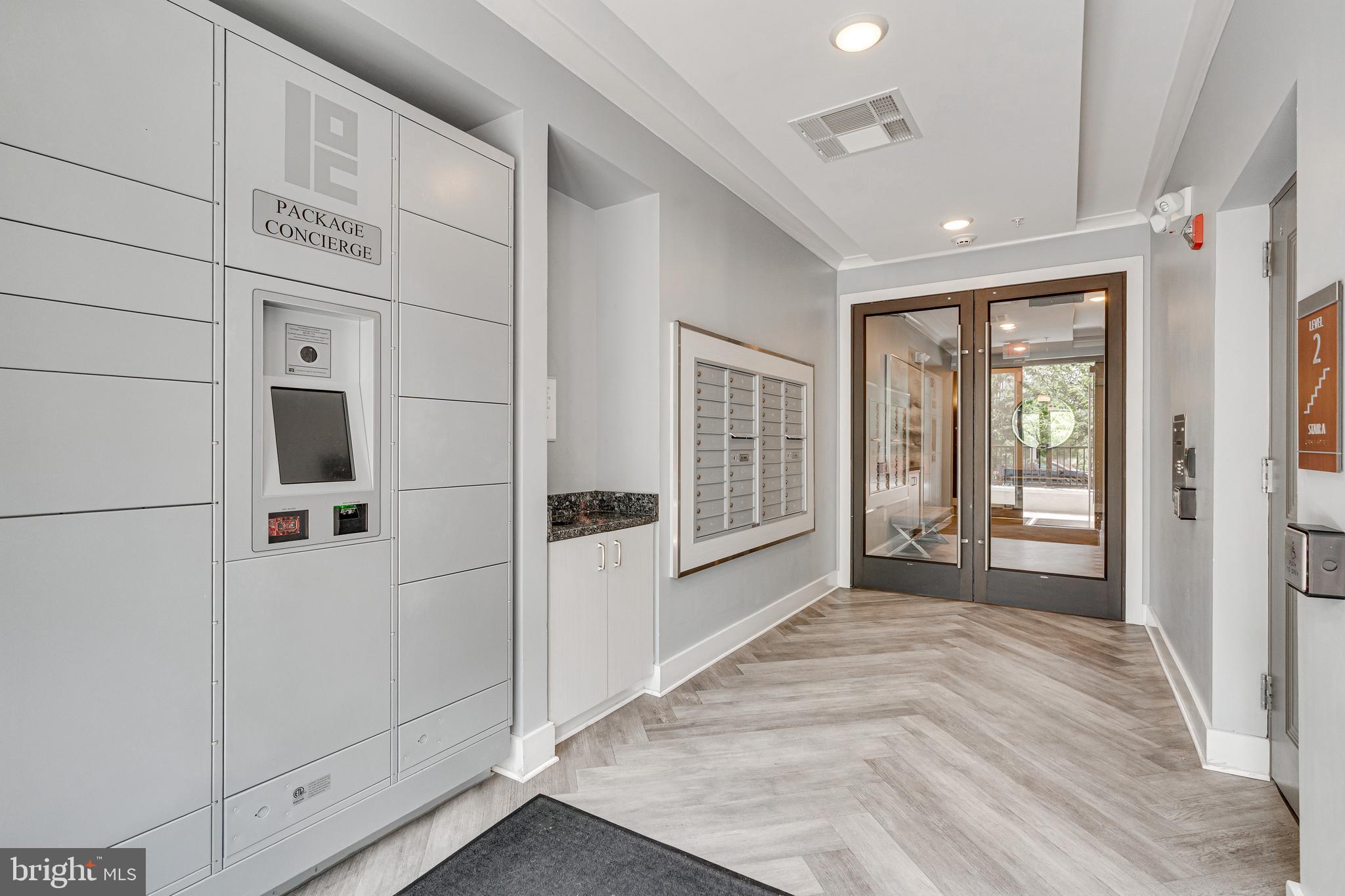 11200 Reston Station Boulevard, Unit 207 Reston, VA 20190 - Photo 34 of 40 a view of a hallway with closet area