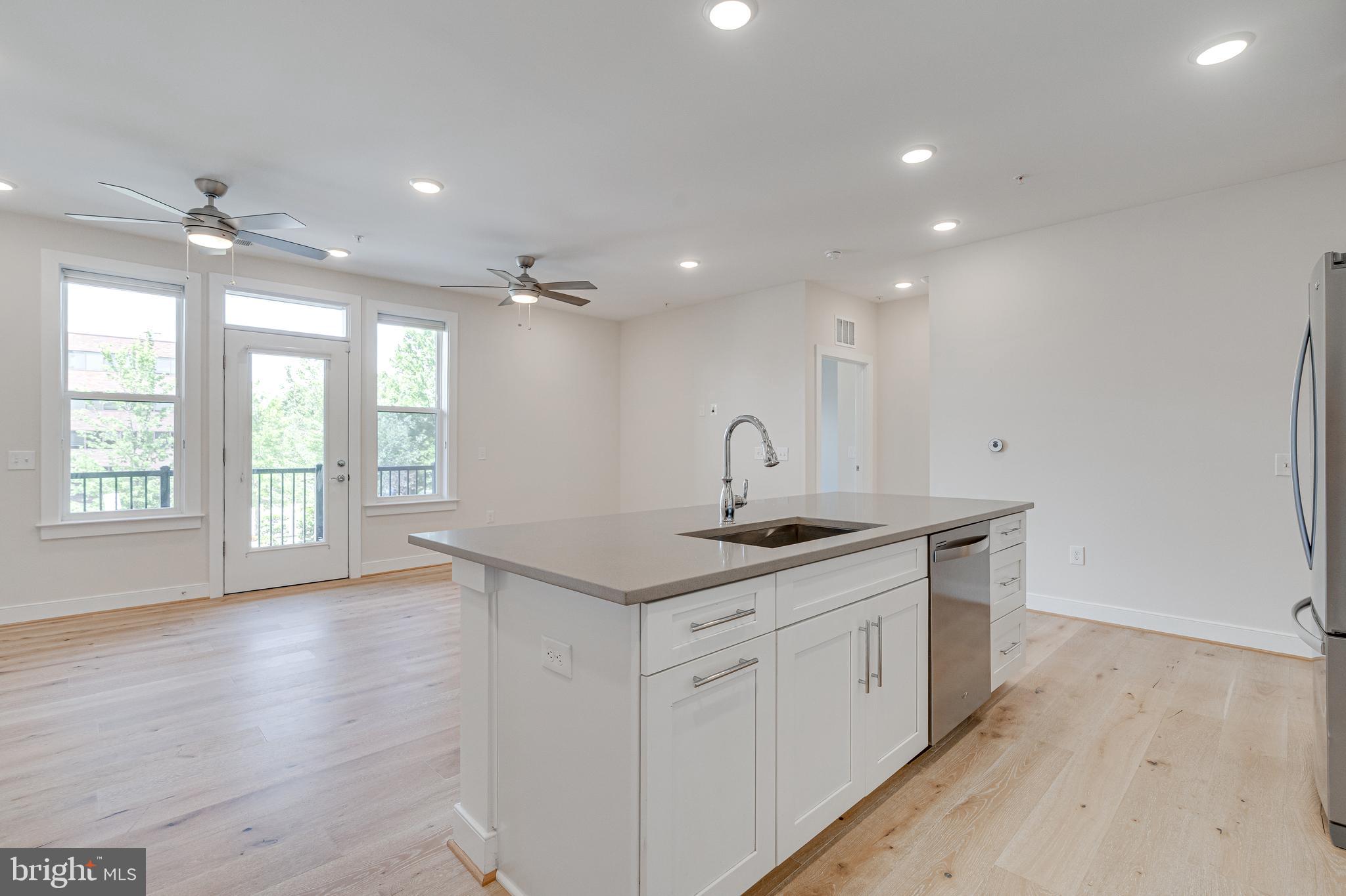 11200 Reston Station Boulevard, Unit 207 Reston, VA 20190 - Photo 7 of 40 a view of a kitchen with a sink and window