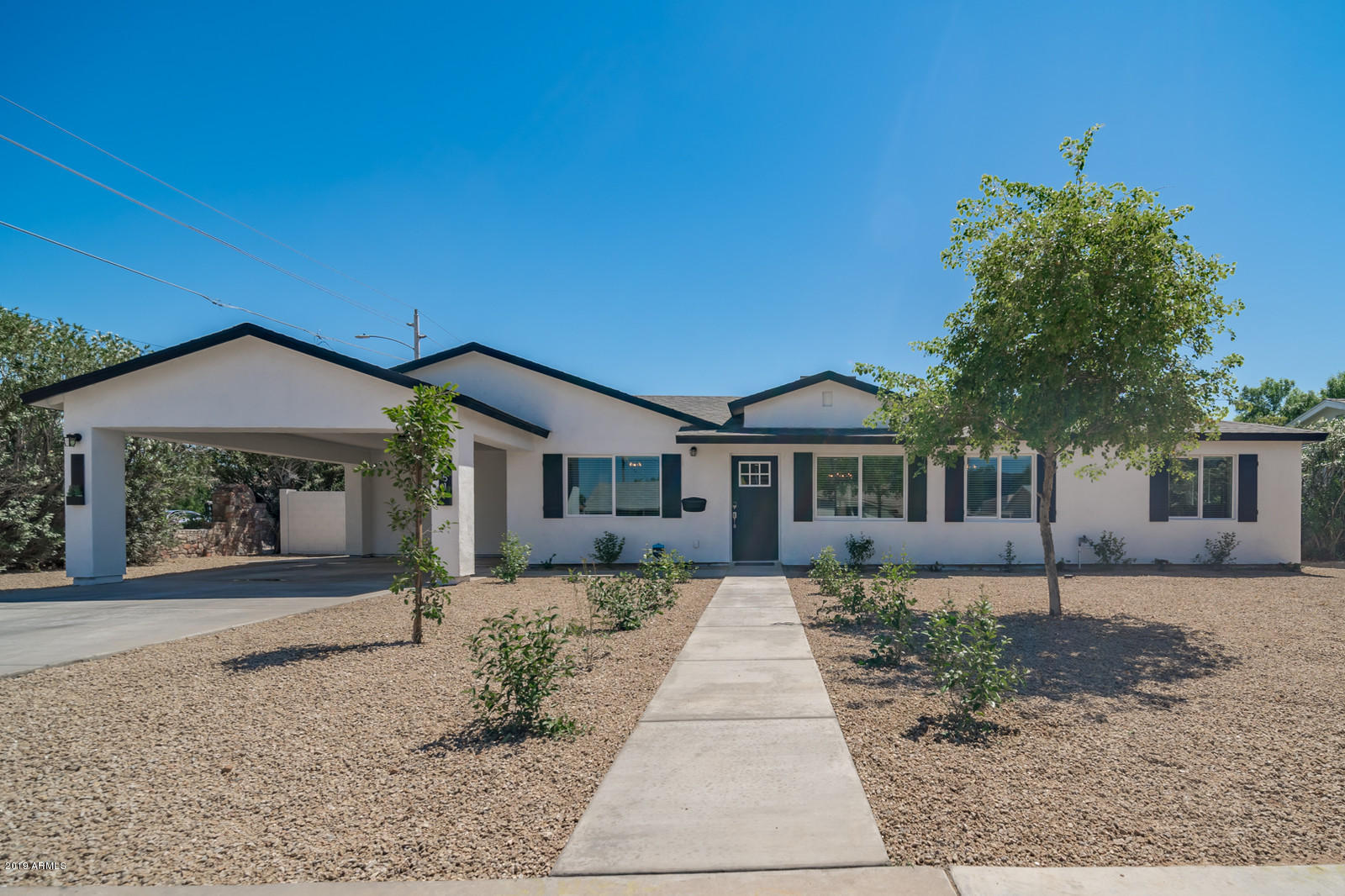 front view of a house with a yard