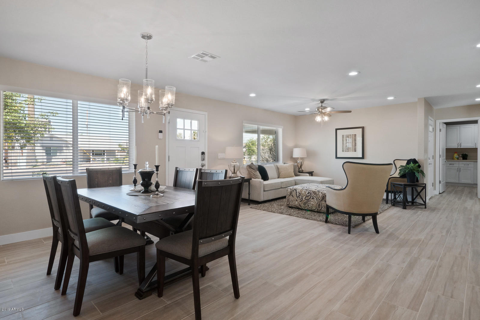 3351 North Randolph Road Phoenix, AZ 85014 - Photo 2 of 47 a view of a dining room with furniture and wooden floor