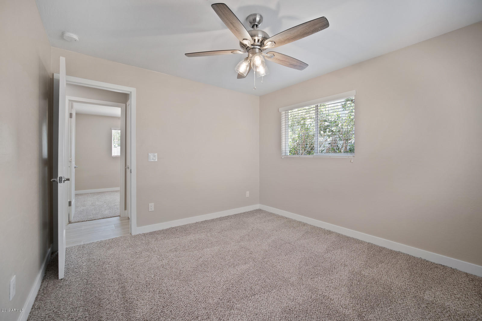 3351 North Randolph Road Phoenix, AZ 85014 - Photo 23 of 47 an empty room with windows and fan