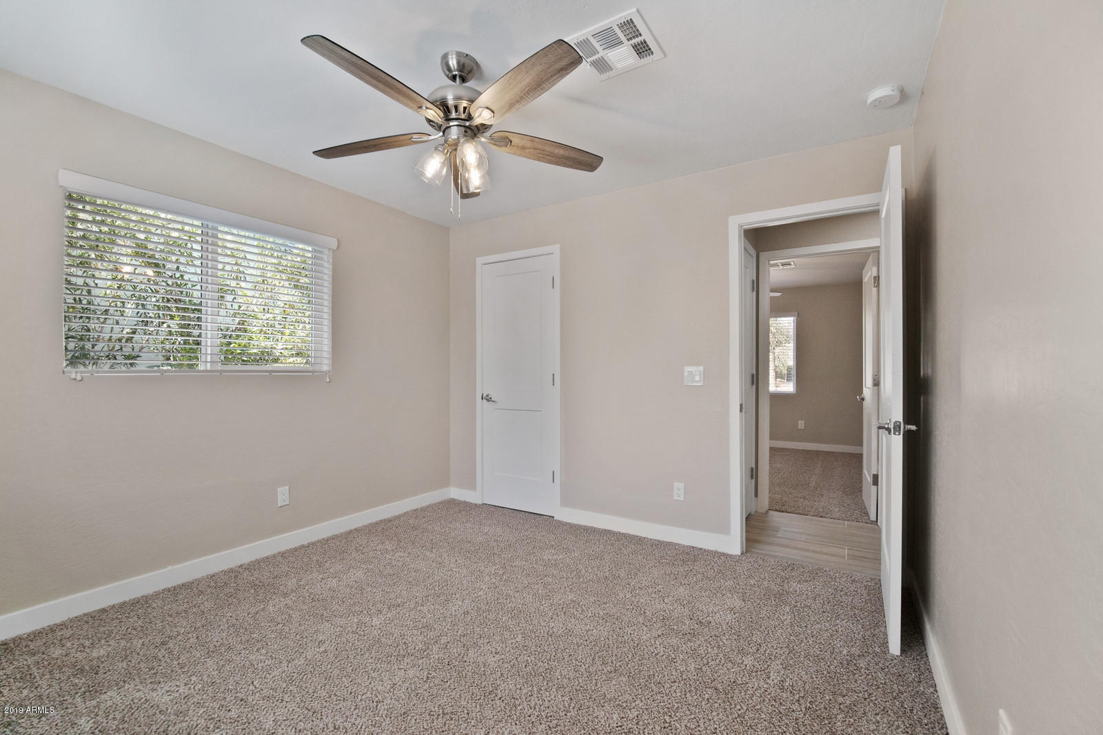3351 North Randolph Road Phoenix, AZ 85014 - Photo 25 of 47 a view of an empty room with a window