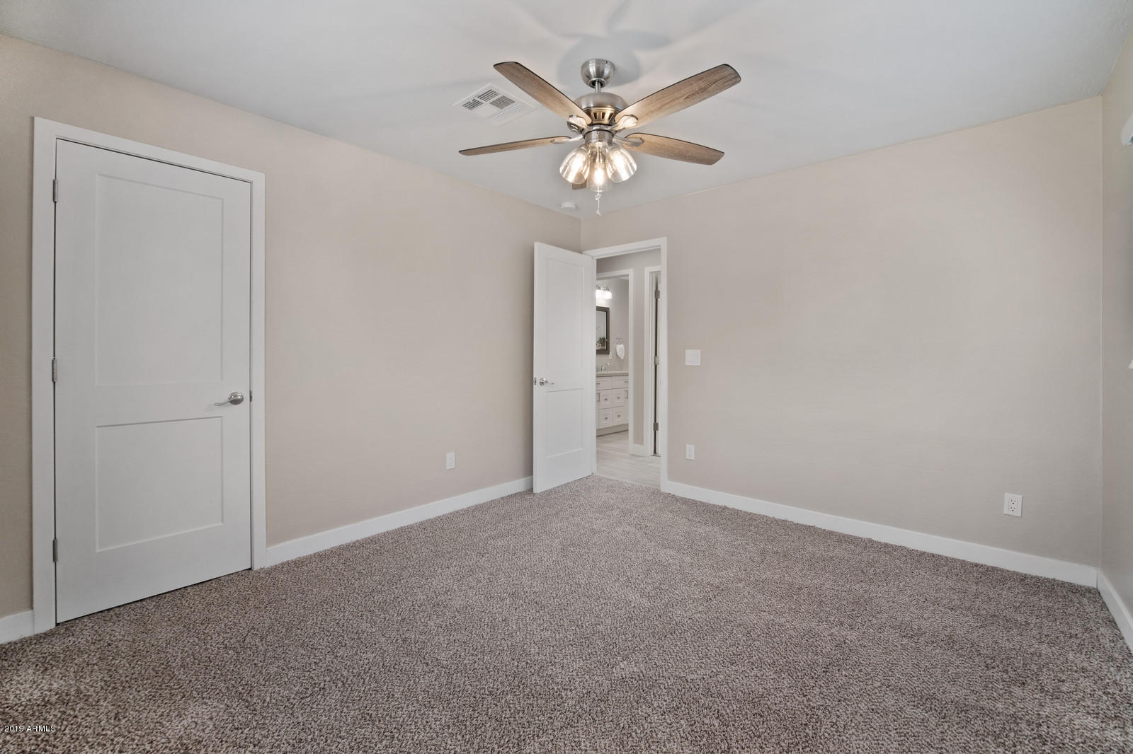 3351 North Randolph Road Phoenix, AZ 85014 - Photo 27 of 47 a view of an empty room with a chandelier fan