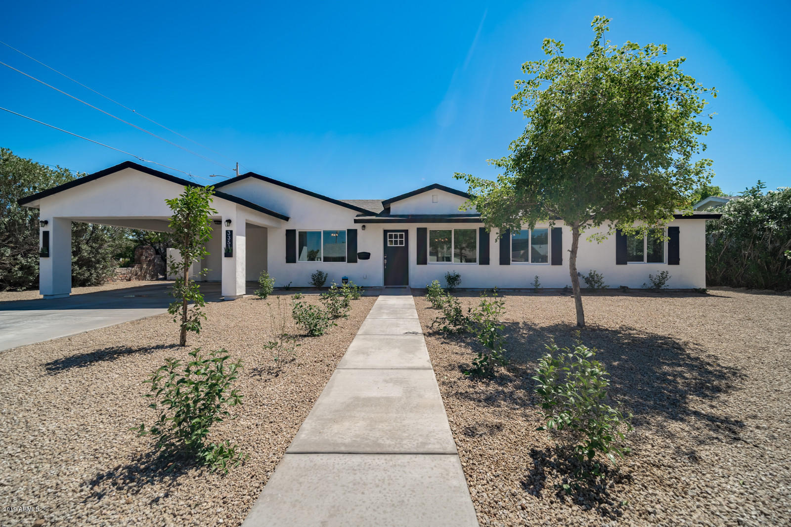 3351 North Randolph Road Phoenix, AZ 85014 - Photo 33 of 47 a front view of a house with a yard
