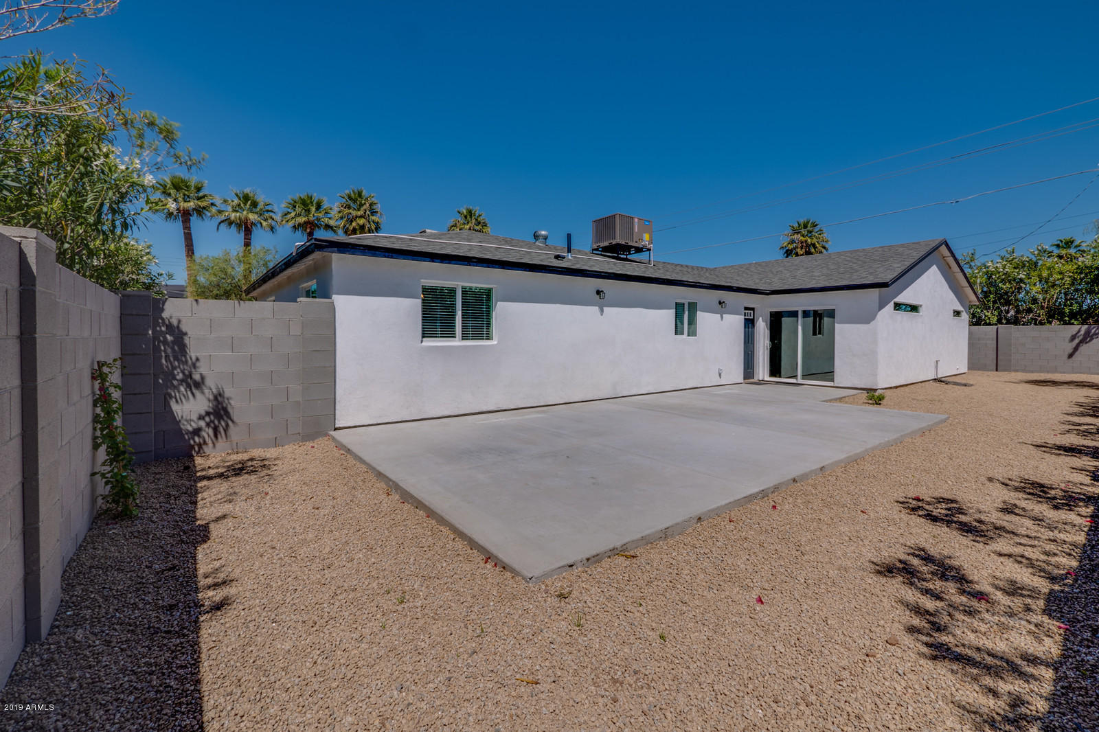 3351 North Randolph Road Phoenix, AZ 85014 - Photo 44 of 47 a view of a house with a backyard