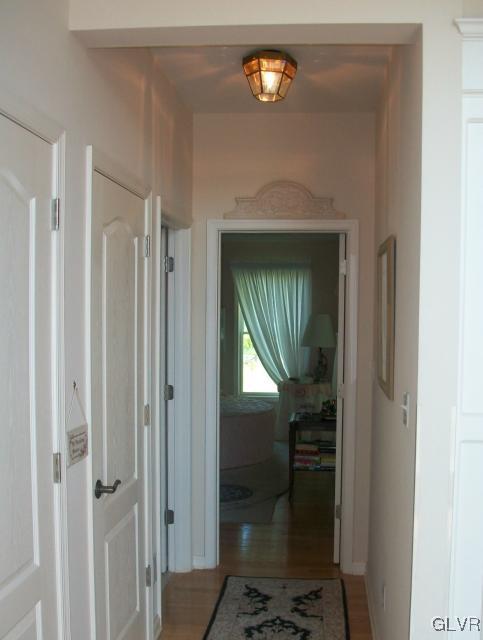 186 Heyer Road Nazareth, PA 18064 - Photo 23 of 49 a view of a hallway with wooden floor fireplace and living room