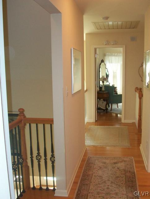 186 Heyer Road Nazareth, PA 18064 - Photo 33 of 49 a view of a hallway with wooden floor and a living room
