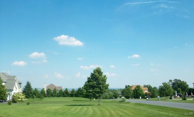 186 Heyer Road Nazareth, PA 18064 - Photo 48 of 49 a view of a golf course with a lake