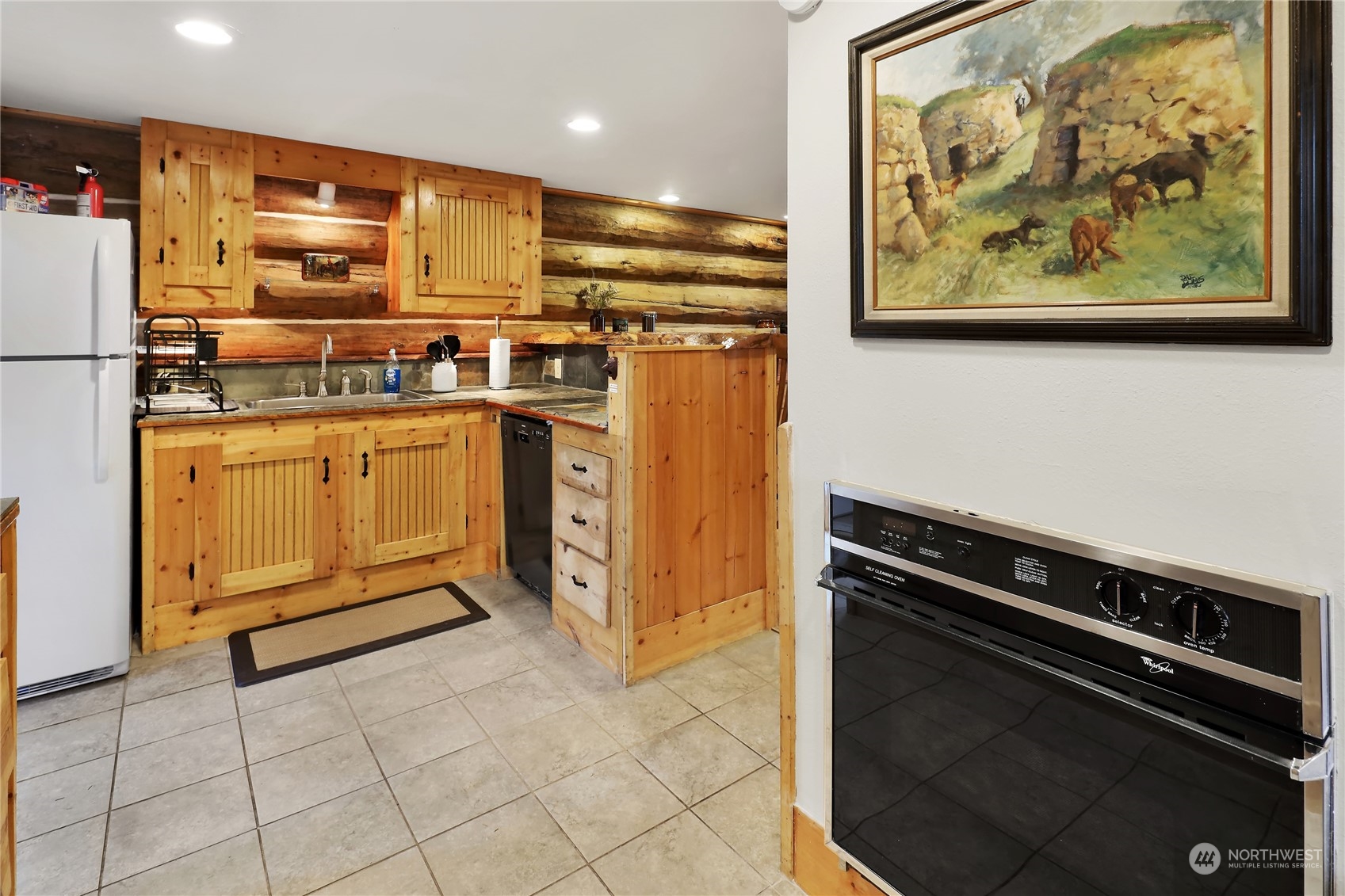 2011 Clear Valley Drive Maple Falls, WA 98266 - Photo 13 of 40 a kitchen with stainless steel appliances a stove a refrigerator and cabinets