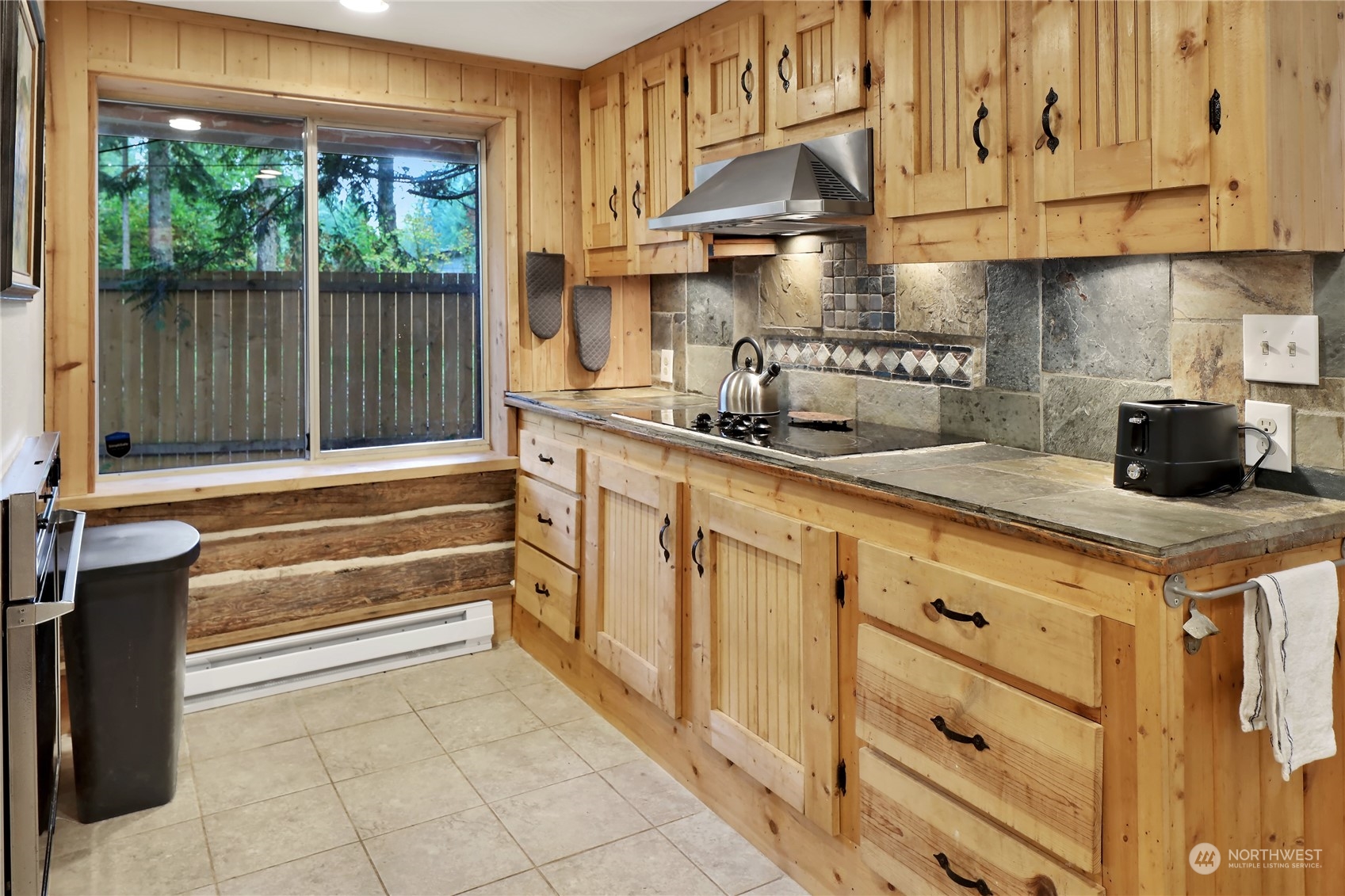2011 Clear Valley Drive Maple Falls, WA 98266 - Photo 16 of 40 a kitchen with granite countertop a sink a stove and cabinets