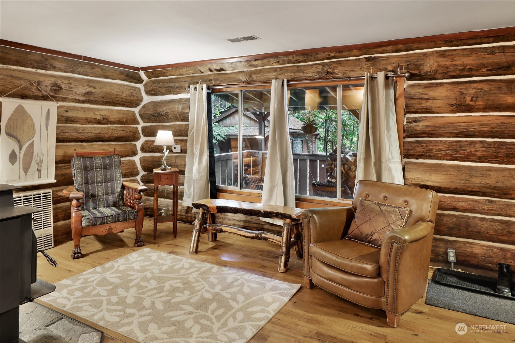 2011 Clear Valley Drive Maple Falls, WA 98266 - Photo 21 of 40 a living room with furniture and a floor to ceiling window