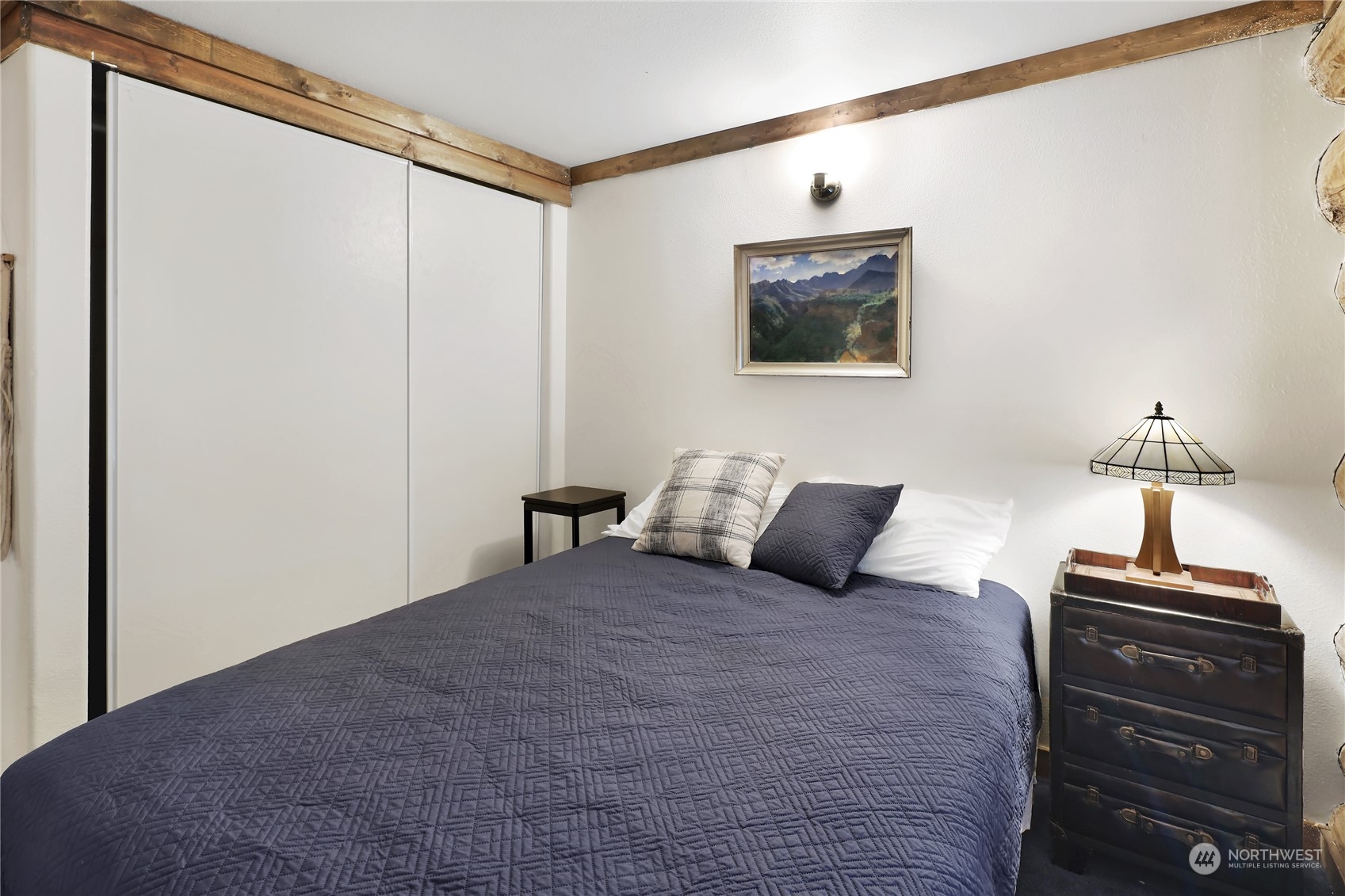 2011 Clear Valley Drive Maple Falls, WA 98266 - Photo 33 of 40 a bedroom with a bed and a lamp on table