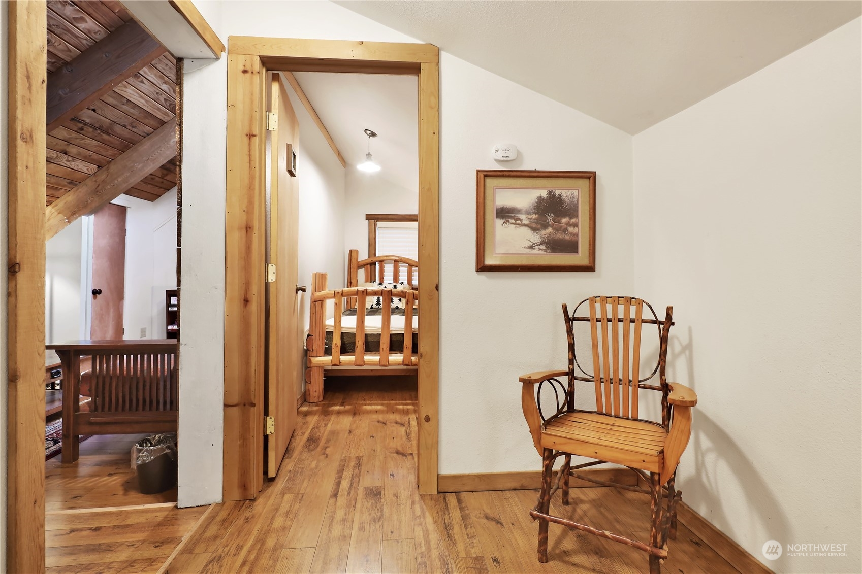 2011 Clear Valley Drive Maple Falls, WA 98266 - Photo 35 of 40 a view of a hallway with wooden floor and a bathroom