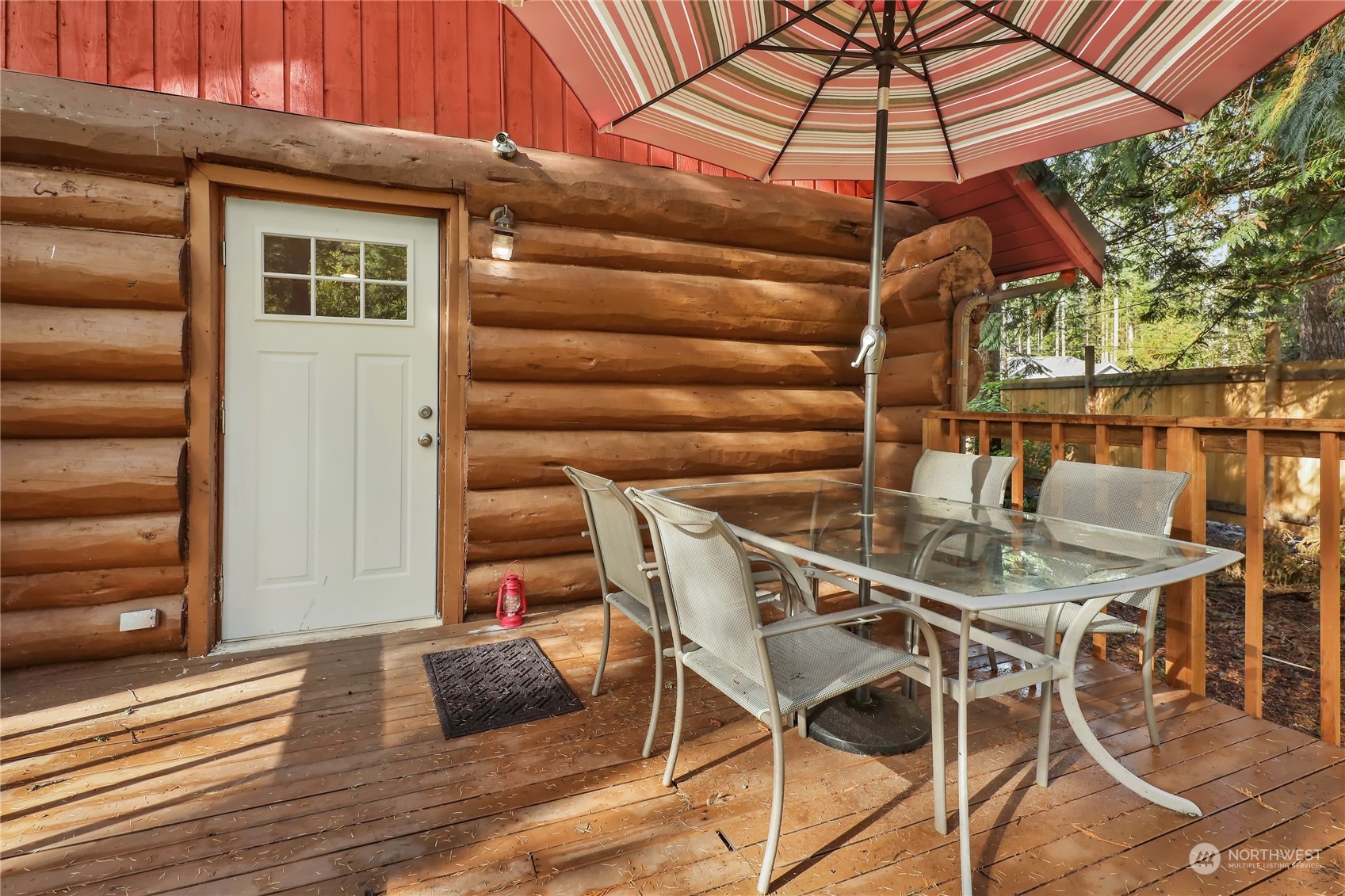 2011 Clear Valley Drive Maple Falls, WA 98266 - Photo 39 of 40 a patio with a table and chairs under an umbrella