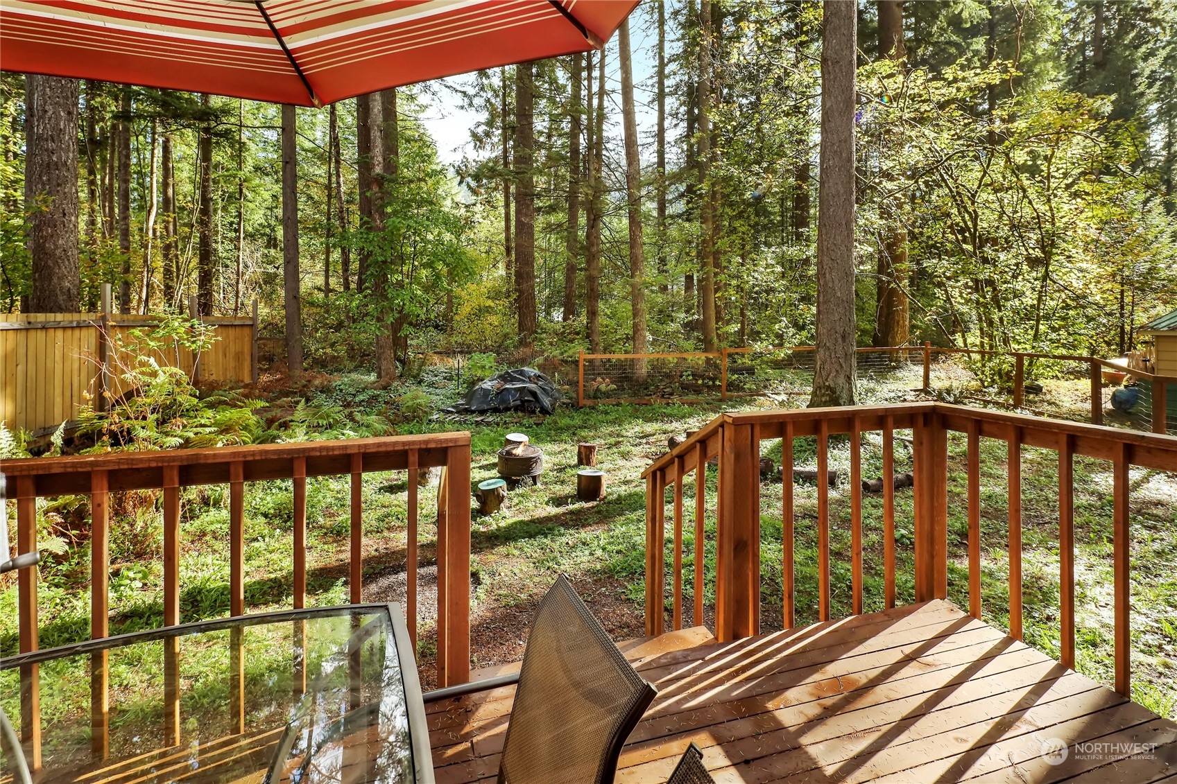 2011 Clear Valley Drive Maple Falls, WA 98266 - Photo 40 of 40 a view of a balcony with chairs and wooden fence
