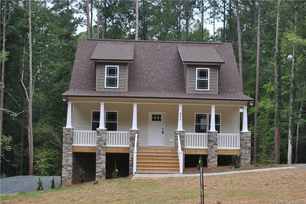 335 Creswell Road, Unit 1011 Mount Gilead, NC 27306 - Photo 2 of 18 a front view of a house with a balcony