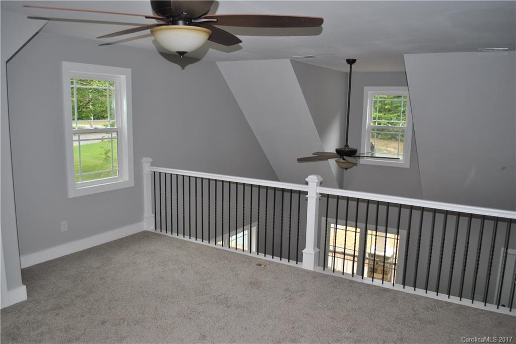 335 Creswell Road, Unit 1011 Mount Gilead, NC 27306 - Photo 11 of 18 a view of entryway with a window and a chandelier fan